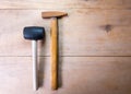 Steel hammer and Rubber Hammer on wood Royalty Free Stock Photo