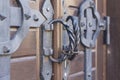 Steel handles on ancient wooden gate Royalty Free Stock Photo