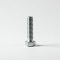 A steel hexagonal bolt with a threaded shaft, standing upright on a plain white Royalty Free Stock Photo