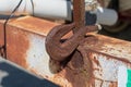 Steel hook welded onto a bumper used to secure a chain on equipment Royalty Free Stock Photo