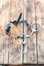 Steel horse snaffle-bit and spurs on wooden background