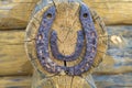 Steel horseshoe on wooden plank background. Old Rusty horseshoes on a wooden wall Royalty Free Stock Photo