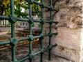 Steel lattice window in the fence of the old cemetery in the Suleymaniye Mosque in Istanbul Turkey. Powerful metal grate in an Royalty Free Stock Photo