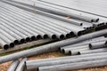 Steel long pipe for industrial. Steel pipes for construction on cement floors. Group of steel pipe for construction on the floor Royalty Free Stock Photo