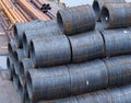 Steel low carbon wire rod, hot rolled steel drawing wire twelve millimeters or half an inch in diameter in coils. Freight Royalty Free Stock Photo