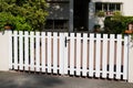Steel low white classic gate aluminum portal with blades of suburban house garden access Royalty Free Stock Photo