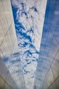 Steel memorial for 9 11 with names of deceased in New Jersey with blue and spotty clouds in sky