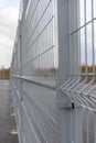 Steel mesh section of portable gray galvanized steel fence close-up