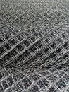 Metal wire netting Rabitz for chain-link fence twisted in rolls close-up