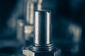 Steel metal fastener on electronic board close up shot