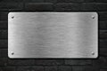 Steel metal plate over brick wall 3d illustration Royalty Free Stock Photo