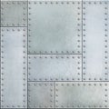 Steel metal plates with rivets seamless background Royalty Free Stock Photo