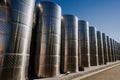 Steel modern cisterns for wine production on plant territory. Large tanks Royalty Free Stock Photo