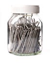 Steel nails neatly stacked in a glass jar Royalty Free Stock Photo