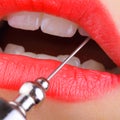 Steel needle in the woman`s mouth Royalty Free Stock Photo