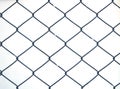 Steel net fence with blur background Royalty Free Stock Photo