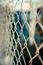 Steel net fence with blur background Royalty Free Stock Photo
