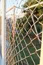 Steel net fence with blur background Royalty Free Stock Photo