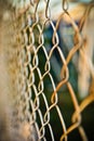 Steel net fence with blur background Royalty Free Stock Photo