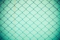 Steel net fence with blur background Royalty Free Stock Photo