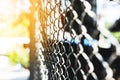 Steel net fence perspective view, selective focus with shallow depth of field Royalty Free Stock Photo