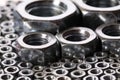 Steel nuts and screws on mirror Royalty Free Stock Photo