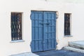 Steel old blue door with windows on the lattice on Royalty Free Stock Photo