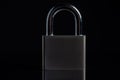 Steel padlock on the black textured background Royalty Free Stock Photo