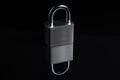 Steel padlock on the black textured background Royalty Free Stock Photo