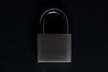Steel padlock on the black textured background Royalty Free Stock Photo