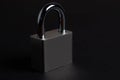 Steel padlock on the black textured background Royalty Free Stock Photo