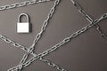 Steel padlock and chains on grey background. Safety concept Royalty Free Stock Photo