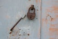 Metal padlocks on the iron door . On steel hinges.