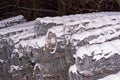 Steel, painted, fence mesh in rolls, partially covered with snow . Royalty Free Stock Photo