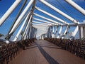 Steel pedestrian bridge over a busy street Royalty Free Stock Photo