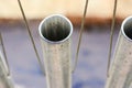 Steel pipes in beautiful fine steel wire suspended Royalty Free Stock Photo