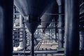 Steel pipes and filtration vats at brewery production beer factory, industrial background