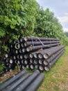 Steel Pipes Stacked Outdoors for Drainage and Infrastructure Installation Royalty Free Stock Photo