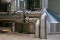 Steel pipes and tank for wort boiling at beer factory - brewery equipment Royalty Free Stock Photo