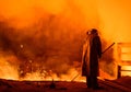 Steelworker near a blast furnace with sparks. Foundry. Heavy industry Royalty Free Stock Photo