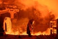 Steelworker near a blast furnace with sparks. Foundry. Heavy industry Royalty Free Stock Photo