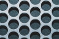 Steel plate with holes. metal grid with round cells. modern background. iron mesh close up Royalty Free Stock Photo