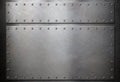 Steel plates with rivets over metal background Royalty Free Stock Photo