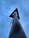 Steel pole with metal ladder for store logo