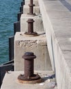 A steel pole that is used to tie boat ropes, when ships are moored at the pier. Royalty Free Stock Photo