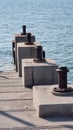 A steel pole that is used to tie boat ropes, when ships are moored at the pier. Royalty Free Stock Photo