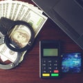Steel police handcuffs, bank card, money dollars, payment device Royalty Free Stock Photo