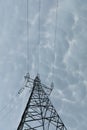 A steel power transmission pole against a backdrop of storm clouds. Royalty Free Stock Photo