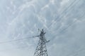 A steel power transmission pole against a backdrop of storm clouds. Royalty Free Stock Photo