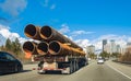 Steel products and tubes on a special truck, industrial transportation. Water pipes transporting on a truck